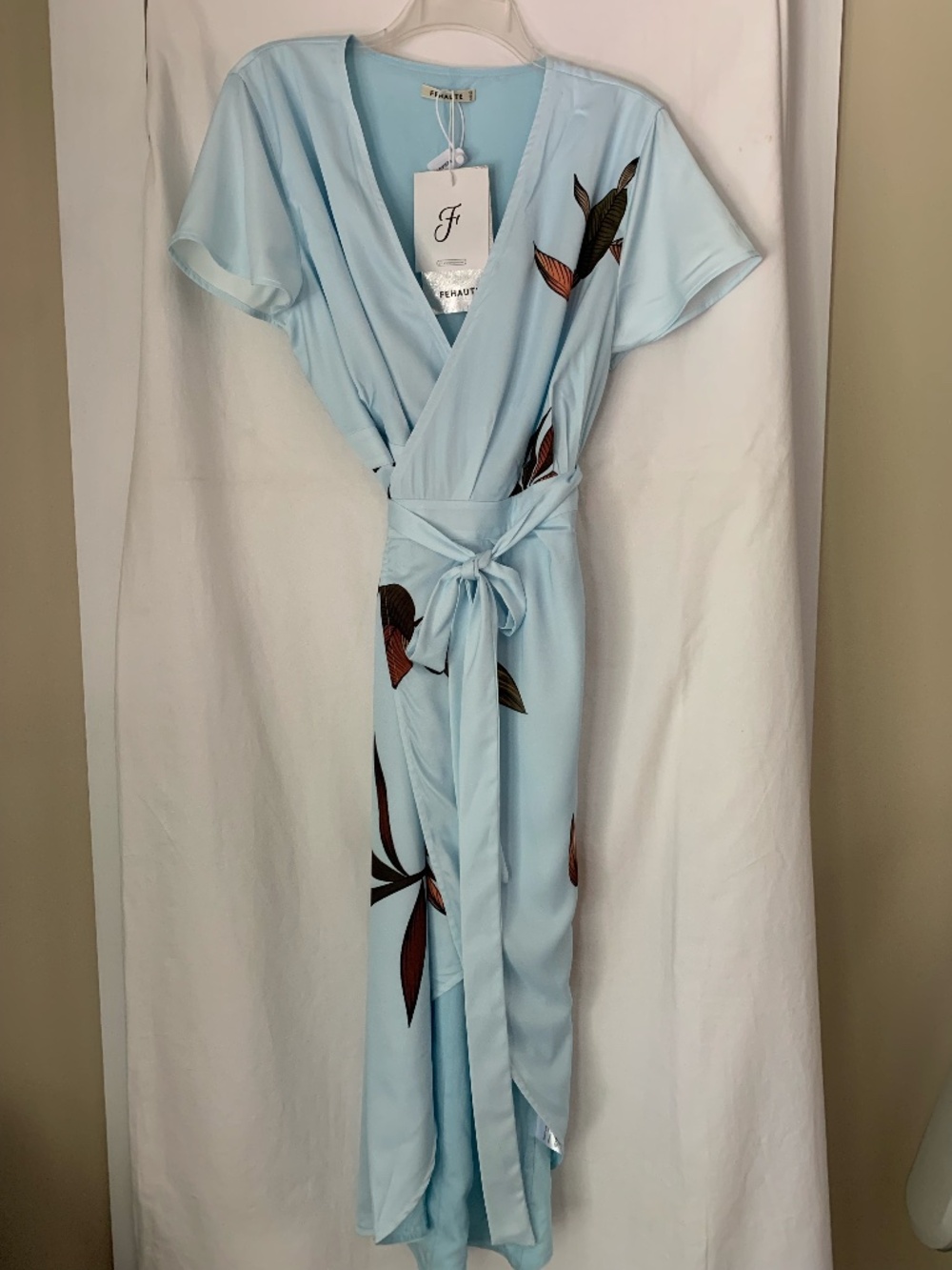 Fehaute light blue satin wrap dress with botanical leaf print & tulip hemline